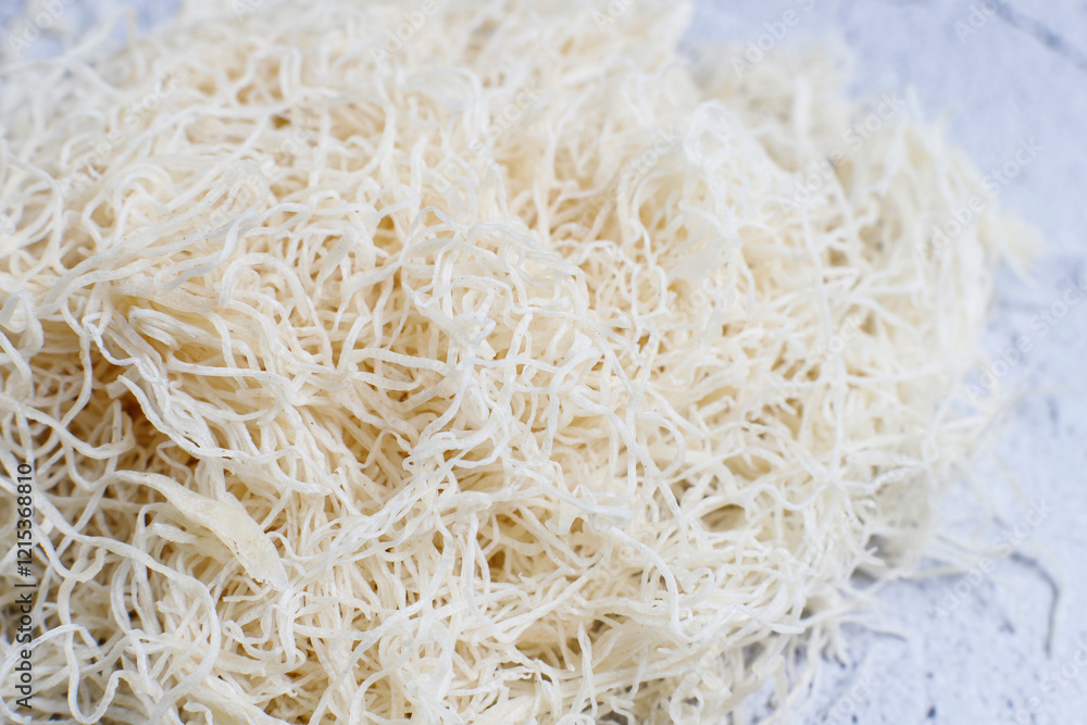 Homemade uncooked kataifi or kadaifi dough. Homemade uncooked kataifi or kadaifi dough.