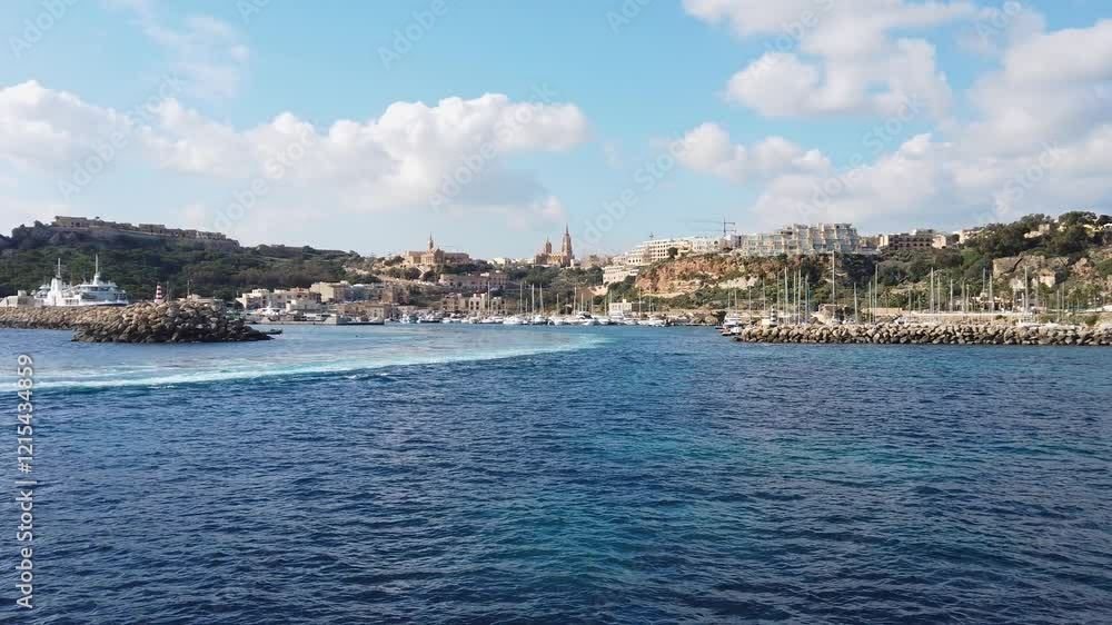 View of the Gozo island harbor from the sea, in the Maltese archipelago View of the Gozo island harbor from the sea, in the Maltese archipelago