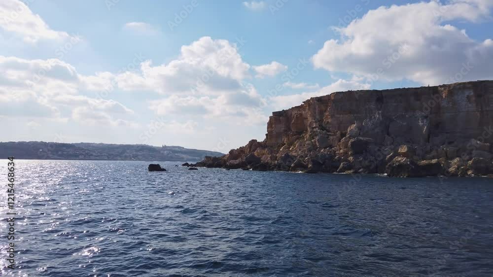 Rocky coast of the northern part of the island of Malta as seen from the sea Rocky coast of the northern part of the island of Malta as seen from the sea