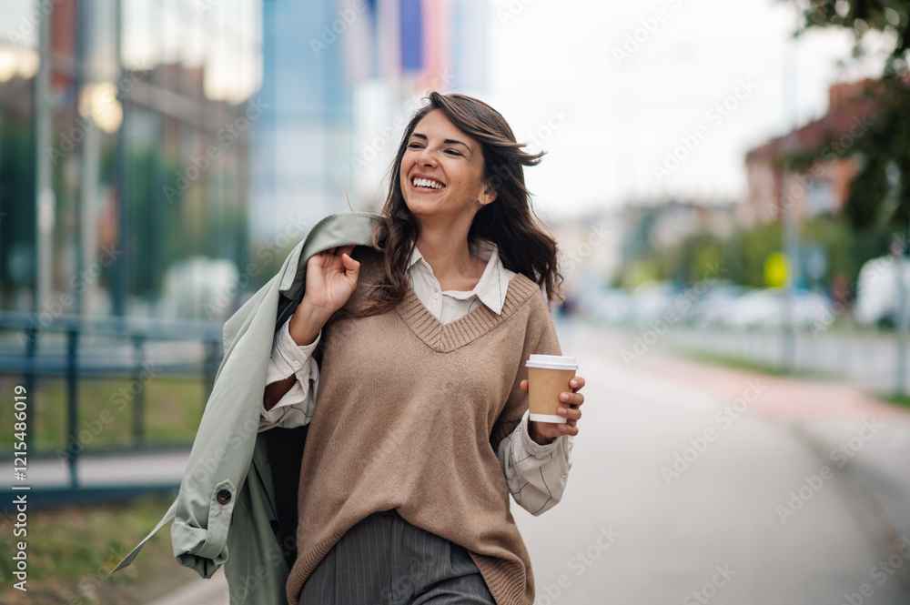 Happy businesswoman walking in the city with coffee Happy businesswoman walking in the city with coffee