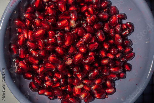 pomegranate seeds in a bowl photo