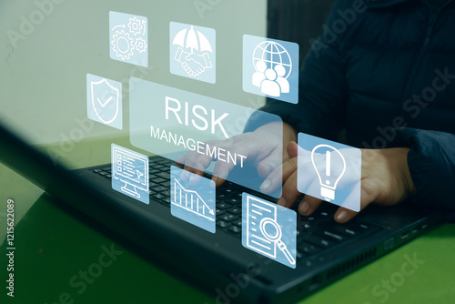 Corporate risk management strategy concept A woman entrepreneur analyzing a virtual risk management interface with critical strategy icons on a laptop screen Analyze risk assessment analysis financial
