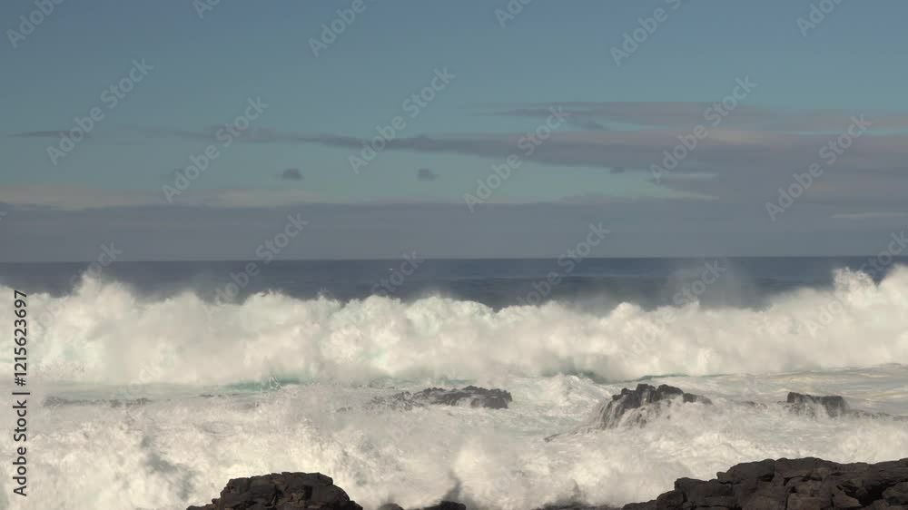 Majestic ocean waves crashing against a tropical island shore, showcasing nature's raw power in a stunning paradise setting. Majestic ocean waves crashing against a tropical island shore, showcasing nature's raw power in a stunning paradise setting.