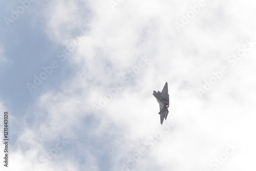 F35 doing stunts at air show and breaking sound barrier. Sonic boom