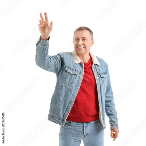Mature man waving hand on w...