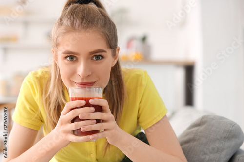Sporty young woman drinking...