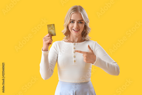 Smiling young woman holding...