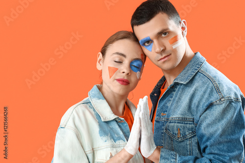 Young couple with painted f...