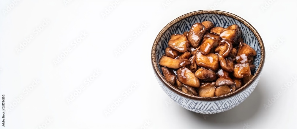 Fototapeta premium Bowl of Japanese sitakotage mushrooms on white background with ample copyspace for culinary or promotional text