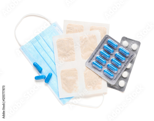 Mustard plasters with pills and medical mask on white background photo