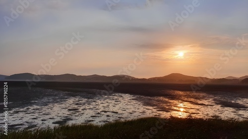 Puesta de sol sobre tierras recuperadas del mar. photo