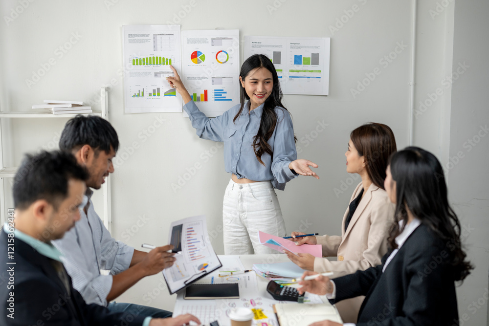 A woman is giving a presentation to a group of people A woman is giving a presentation to a group of people