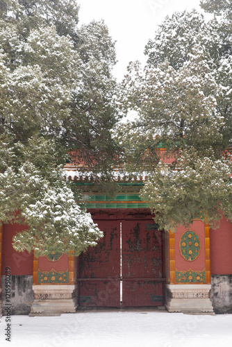 red door gate of Forbidden city in snow photo