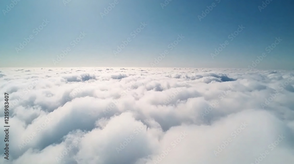 Naklejka premium Aerial view of fluffy white clouds against a clear blue sky.