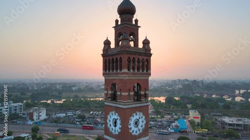 Aerial drone shot of Lucknow’s Clock Tower, with the sun rising behind it, creating a silhouette.