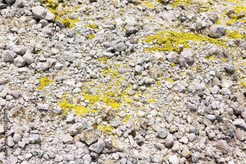 natural Sulfur appears on the surface of limestone in volcanic rock on a volcano photo