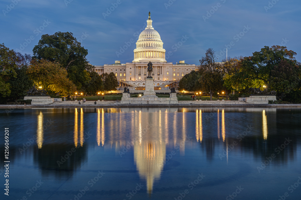 The illuminated United States Capitol in Washington DC at twilight with the famous reflection pool The illuminated United States Capitol in Washington DC at twilight with the famous reflection pool