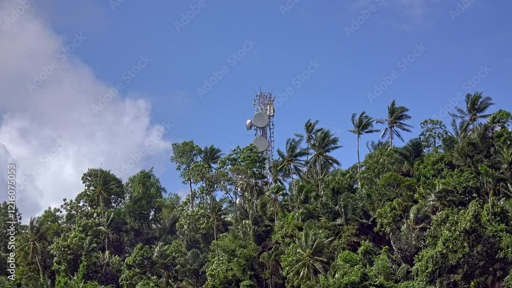 Explore a remote radio and cell relay tower hidden atop a palm-covered mountain in rural Philippines. Explore a remote radio and cell relay tower hidden atop a palm-covered mountain in rural Philippines.