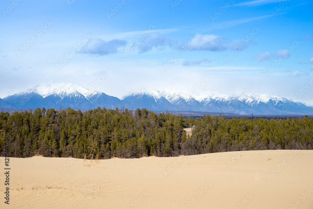 Russia. Beautiful scenery of the northernmost desert in the world. View of the Kodar Ridge. Chara sands. The region of baikaL Kodar National natural park. Russia. Beautiful scenery of the northernmost desert in the world. View of the Kodar Ridge. Chara sands. The region of baikaL Kodar National natural park.
