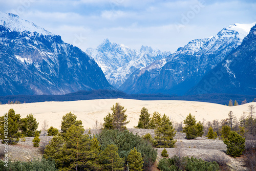 Russia. Beautiful scenery of the northernmost desert in the world. View of the Kodar Ridge. Chara sands. The region of baikaL Kodar National natural park.