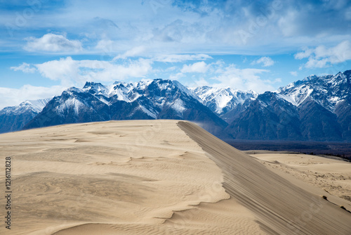 Russia. Beautiful scenery of the northernmost desert in the world. View of the Kodar Ridge. Chara sands. The region of baikaL Kodar National natural park.