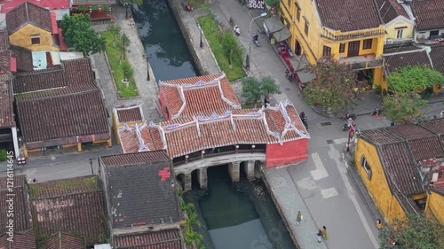 Aerial view of Chua Cau or Japanese Covered ancient Bridge and River in Old city of Hoi An, Vietnam. Vietnamese heritage and culture in Hoian ancient town