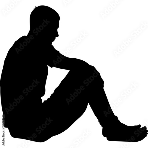 A man is sitting on the ground. He is wearing a black shirt and black pants. He is looking down