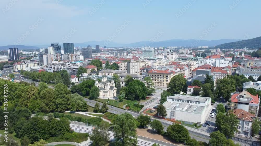 Aerial view of Ljubljana's cityscape featuring historic and modern buildings with Tivoli Park in the foreground, Slovenia. Aerial view of Ljubljana's cityscape featuring historic and modern buildings with Tivoli Park in the foreground, Slovenia.