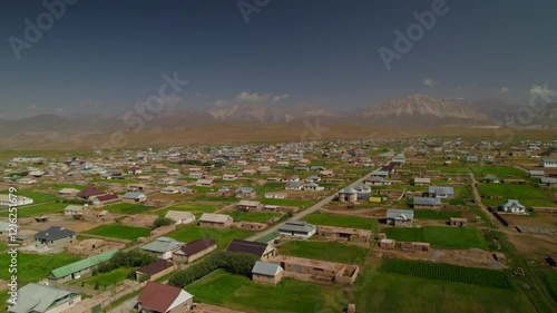 Aerial view of Sary Mogol town with Pamir mountains range in summer season, Kyrgyzstan, Asia photo