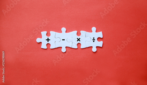 jigsaw puzzle with plus, minus, multiplication and division symbols. Four Basic Mathematical Operations. Addition, Subtraction, multiplication, division. photo