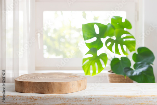 Fototapeta Naklejka Na Ścianę i Meble -  Wooden stand on table with copy space in blurred domestic room window interior