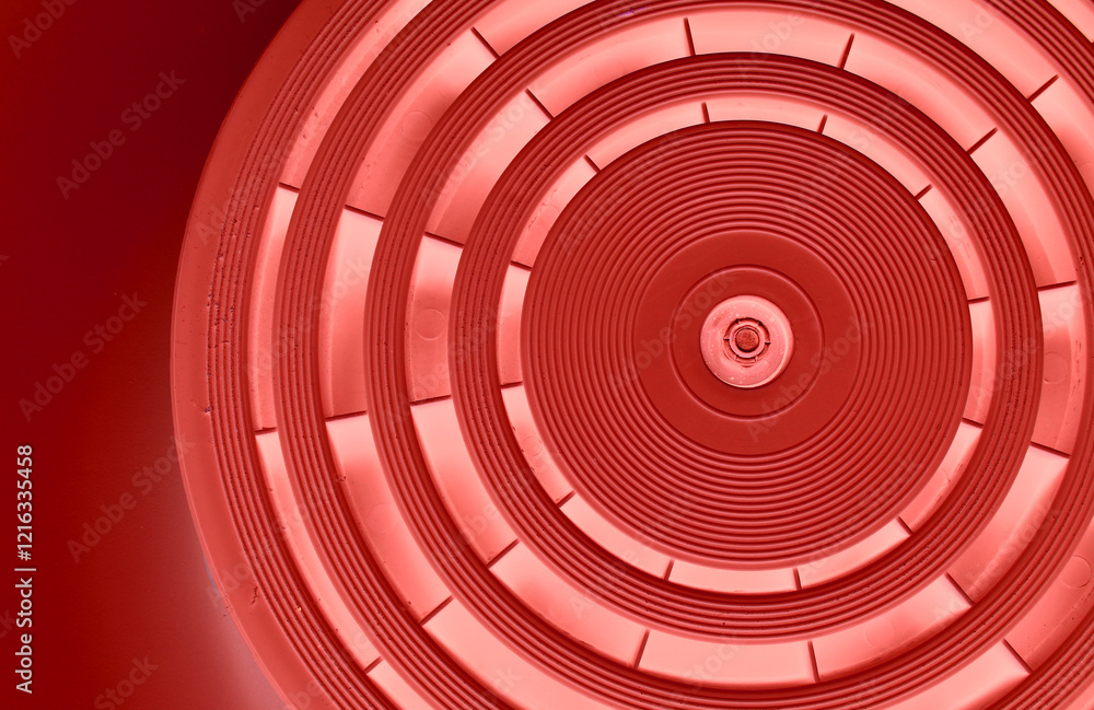 Fototapeta premium Abstract Circular Pattern With Red Backlit Of Same Segments On Dark Red Background 