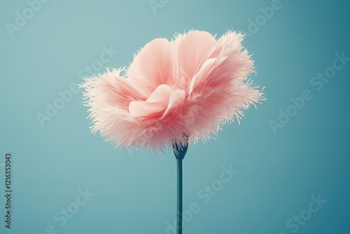 Delicate pink flower with soft, feathery petals against serene b photo