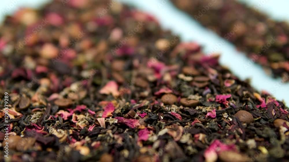 dry tea leaves. A large amount of dry green tea with pieces of fruit, delicious and fragrant green tea with a pleasant aroma