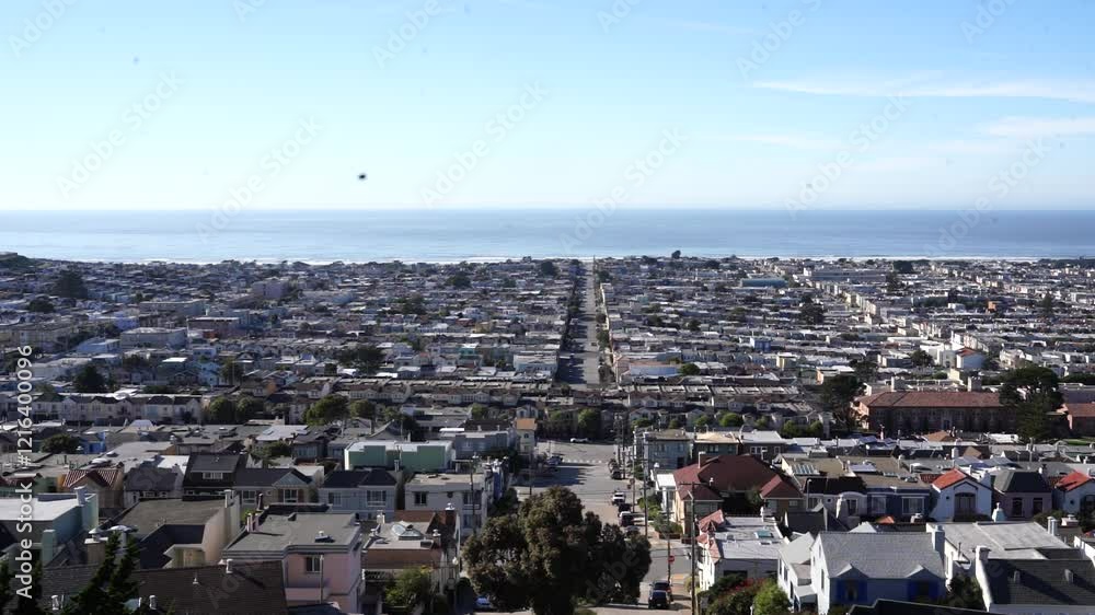 View of a house in San Francisco, overlooking the street and the sea.