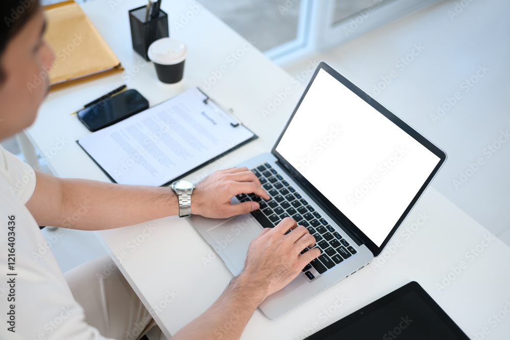 Close up view of young entrepreneur working on laptop in a modern office Close up view of young entrepreneur working on laptop in a modern office