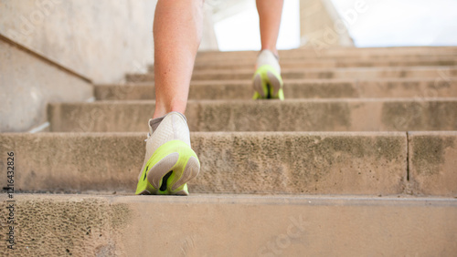 Close-up of feet on stairs during a running workout photo