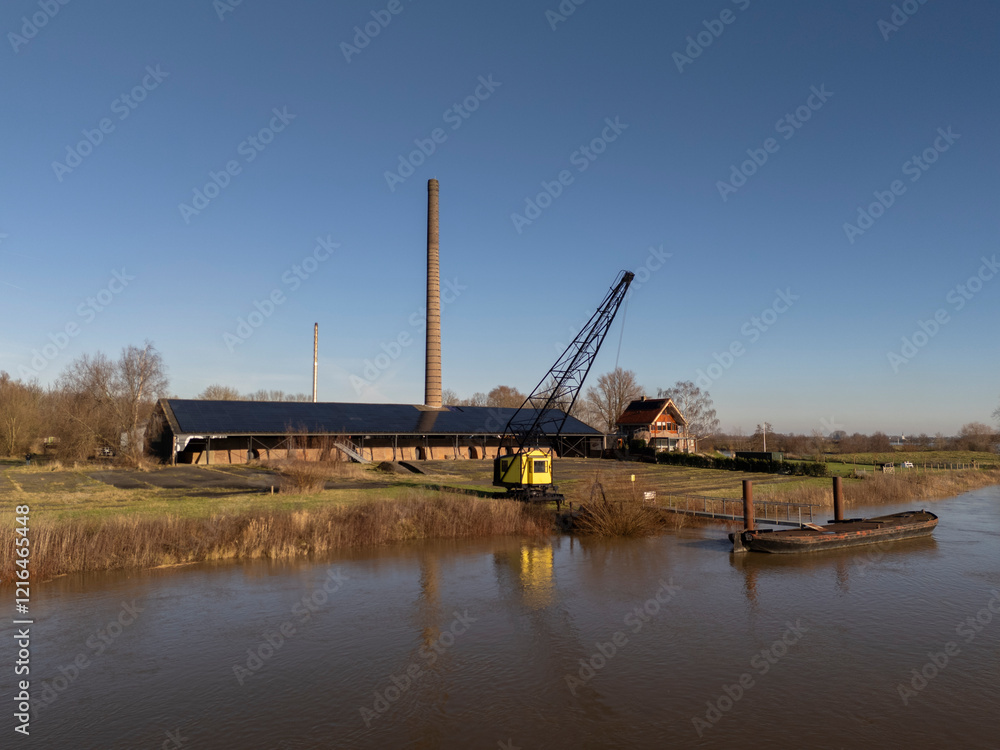 Old Crane at an Abandoned Brick Factory by the River, Drone Shot Old Crane at an Abandoned Brick Factory by the River, Drone Shot
