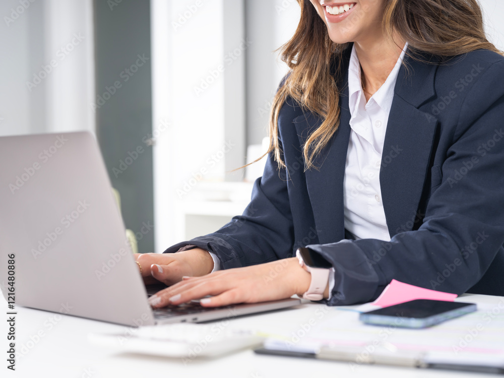 Woman typing on laptop, cropped close up image of young caucasian business woman typing on laptop. Unrecognizable female office worker writing email on notebook sitting desk wear formal suit. Woman typing on laptop, cropped close up image of young caucasian business woman typing on laptop. Unrecognizable female office worker writing email on notebook sitting desk wear formal suit.