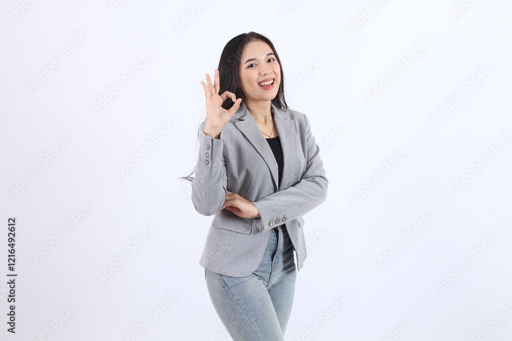 Confident Businesswoman Shows OK Sign, Exuding Professionalism and Success on White Background Confident Businesswoman Shows OK Sign, Exuding Professionalism and Success on White Background