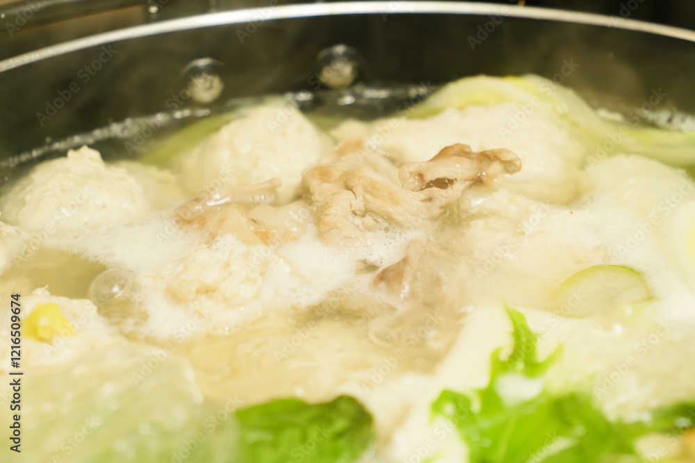 Hot pot with chicken meatballs and vegetables as ingredients, often eaten in winter in Japan Hot pot with chicken meatballs and vegetables as ingredients, often eaten in winter in Japan
