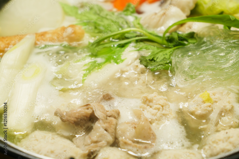 Hot pot with chicken meatballs and vegetables as ingredients, often eaten in winter in Japan Hot pot with chicken meatballs and vegetables as ingredients, often eaten in winter in Japan