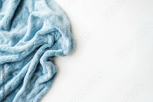 Soft blue fleece blanket arranged on a clean white background, showcasing stylish home textiles with exquisite texture and detail photo