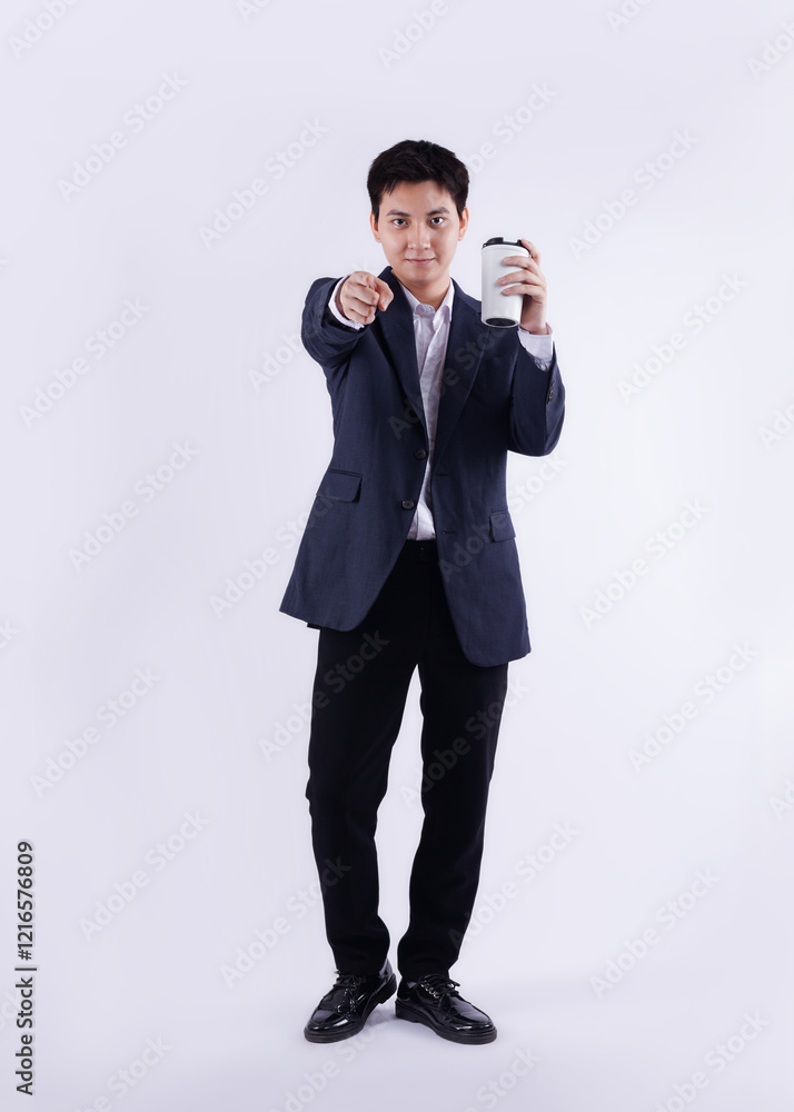 Full body image of a young Asian business man drink coffe and posing on a white background Full body image of a young Asian business man drink coffe and posing on a white background