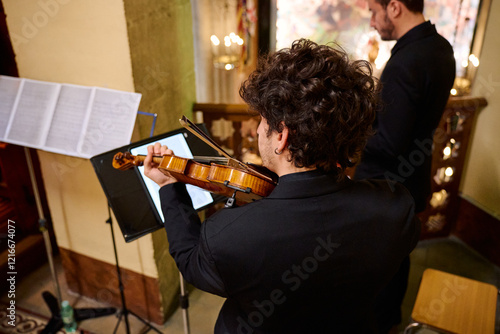 Musicians perform a classical concert in a historic church setting photo