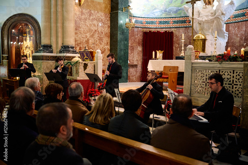 Musicians perform in a beautiful church setting during a concert for the community