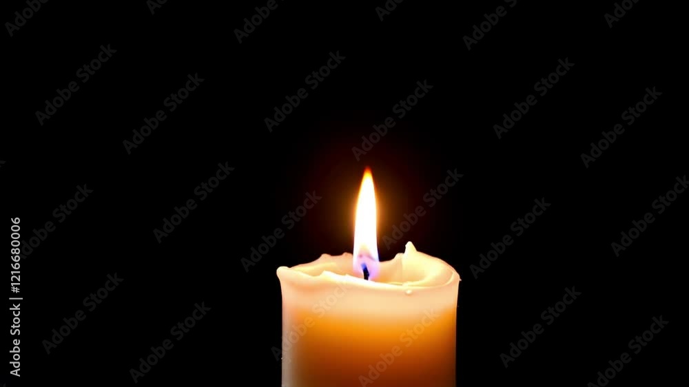 Single candle flame glowing brightly in darkness creating a serene and meditative ambiance. Single candle flame glowing brightly in darkness creating a serene and meditative ambiance.