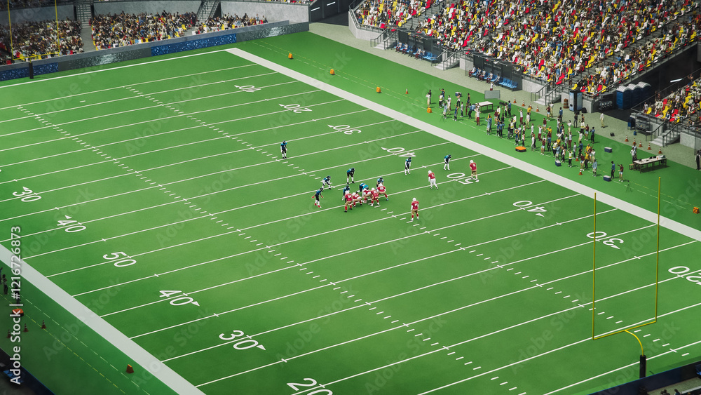 Obraz premium Drone Shot of Two American Football Teams Standing on the Line of Scrimmage as the Ball is Passed to Start the Game. Footballers Ready to Tackle Defenders in Front of a Crowded Dark Stadium with Fans