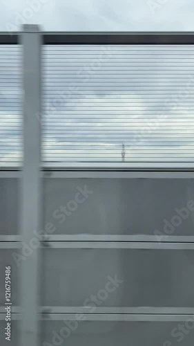 view from inside the high speed train, moving train view of high speed train stone barricade, barrier gate. the speed of the train is increasing over time, it could reach 350km per hour at max. whoosh photo