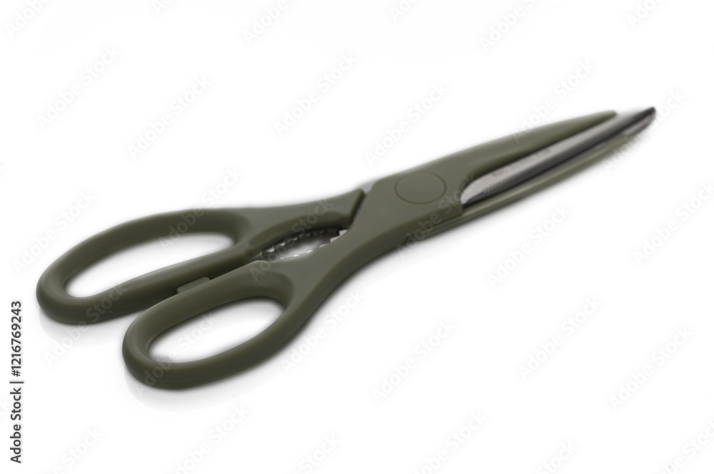 Elegant scissors with a sleek design resting on a white surface in soft natural light Elegant scissors with a sleek design resting on a white surface in soft natural light